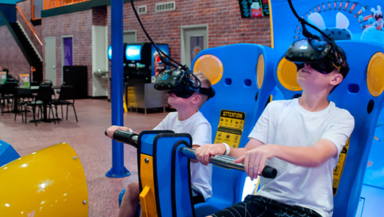 Guests On VR Arcade Attraction